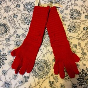 Women’s gloves. Nice orange color. By Caroline Amato. New with tag.